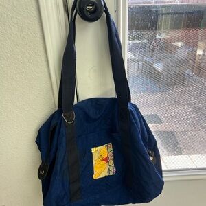 Vintage Blue Duffle Bag with Winnie the Pooh Design